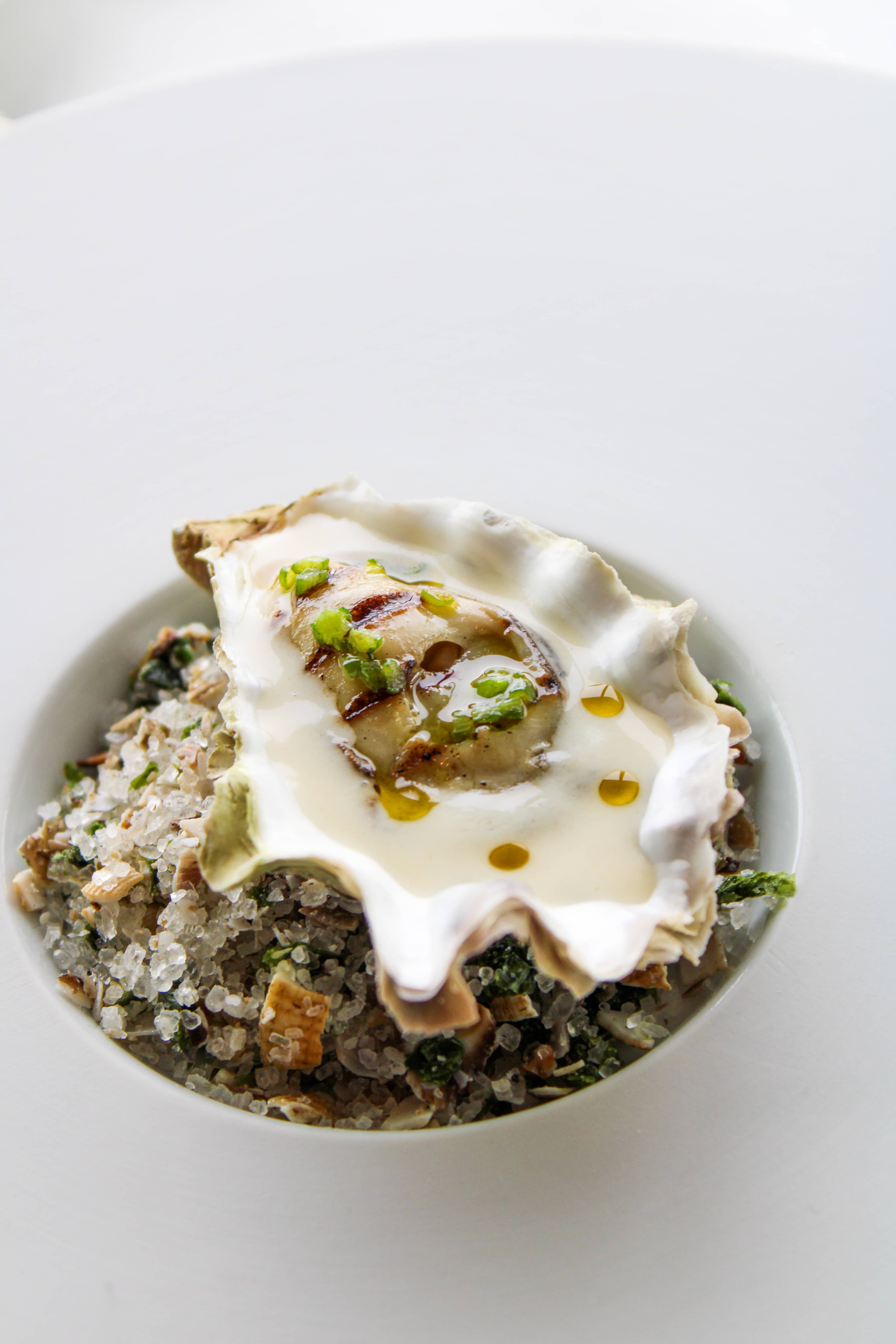 Warm oyster brolatti style, grilled & frozen with a Viognier sauce